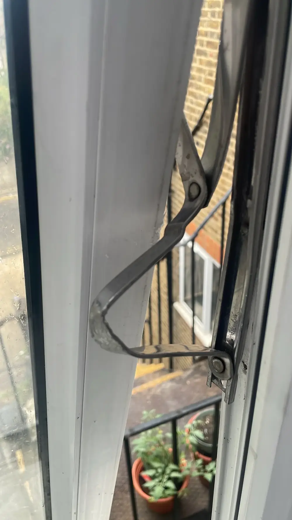 Broken friction hinge on a uPVC window