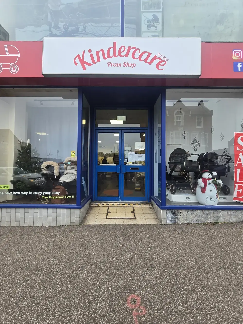 Aluminium shopfront entrance doors at Kindercare pram shop
