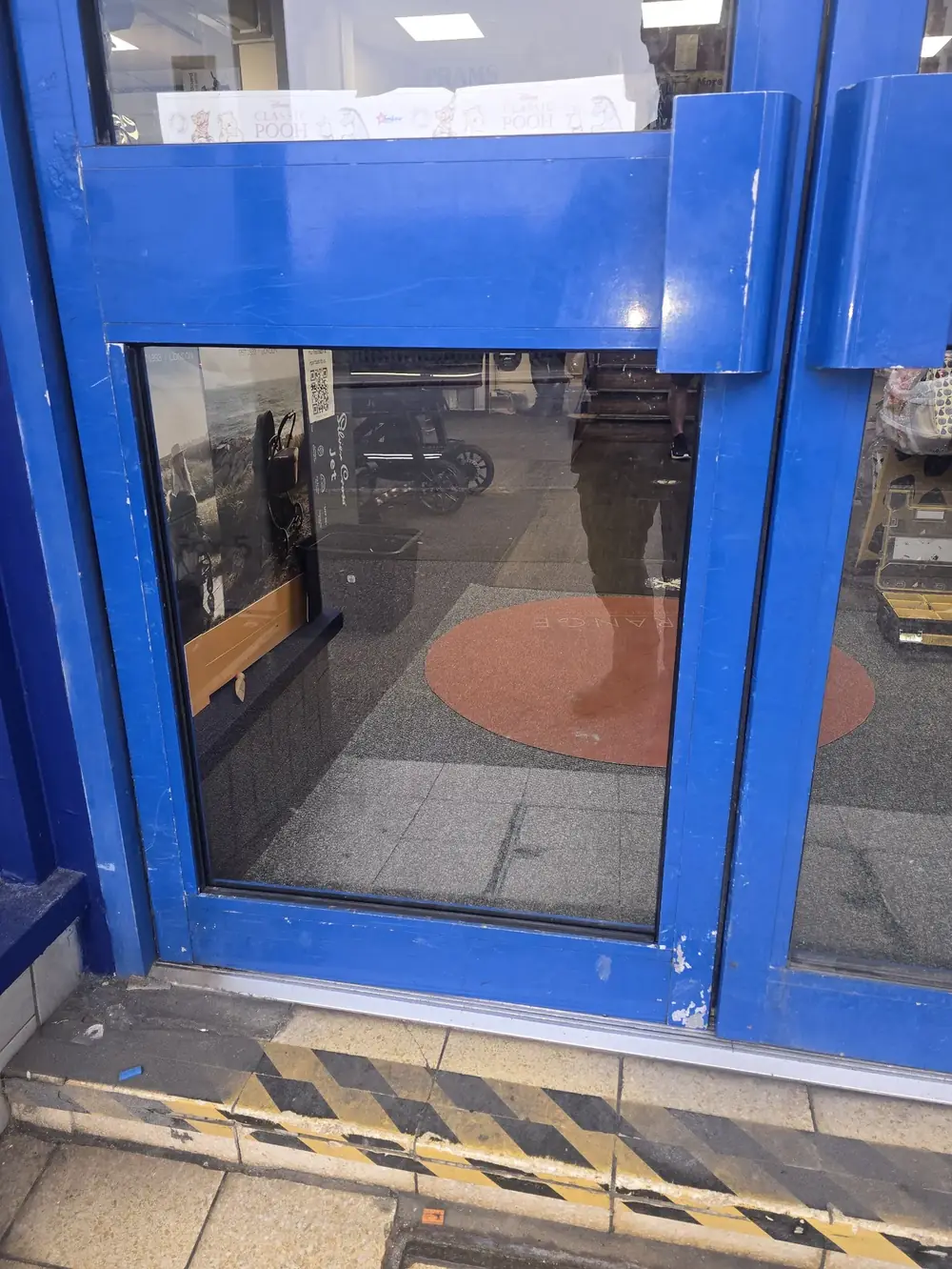 New glass fitted in an aluminium shopfront door