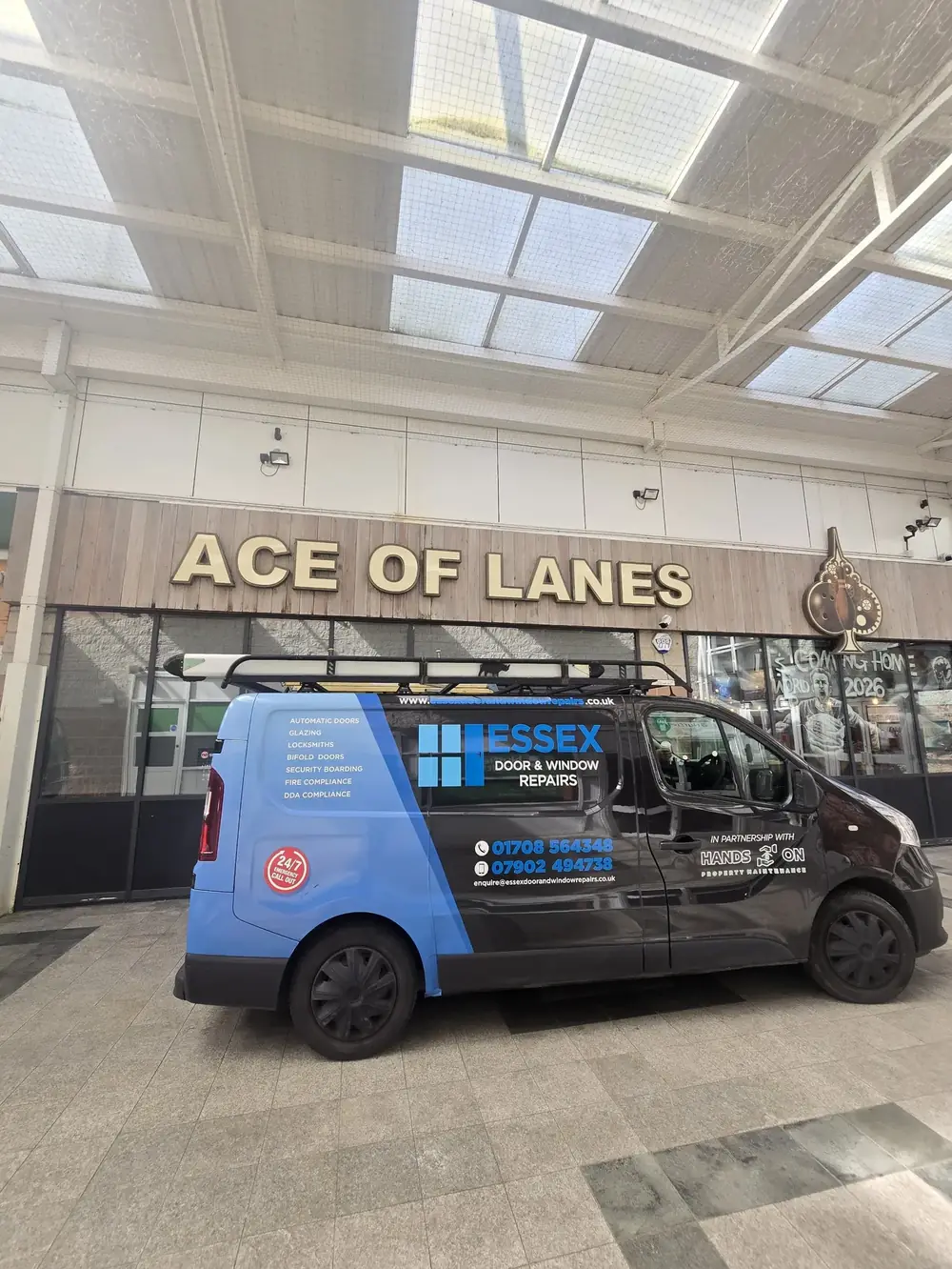 Essex Door & Window Repairs van at a shopping centre