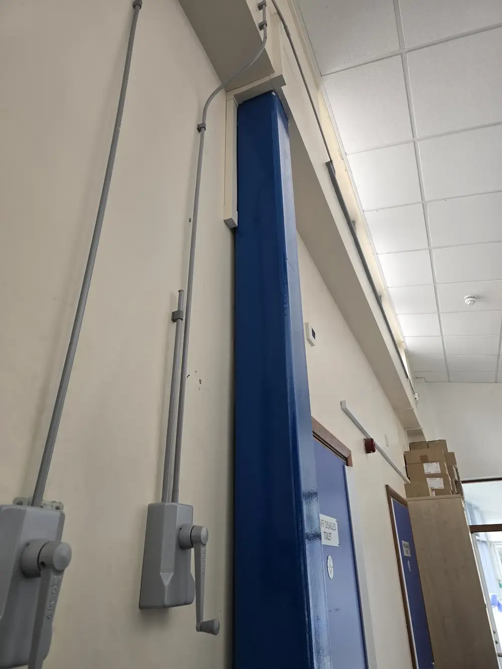 High-level window winders and controls in a commercial building